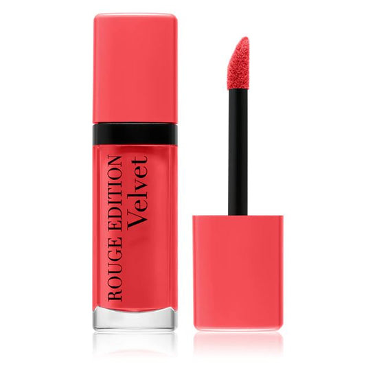 Red lipstick with applicator on a white background