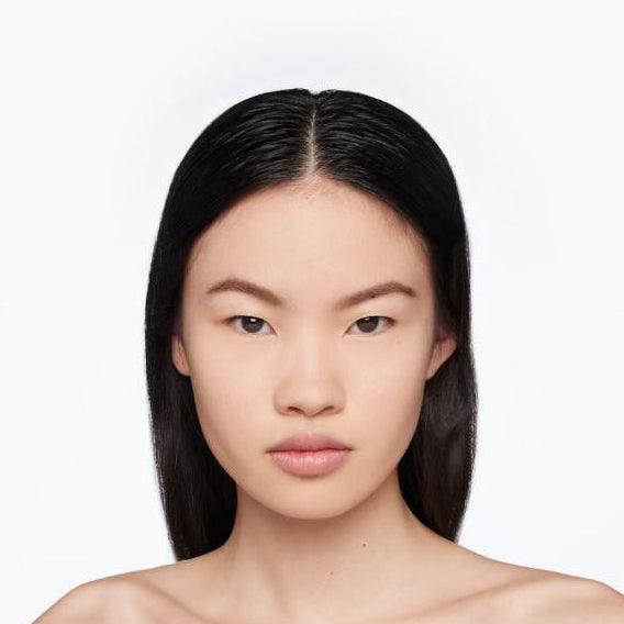 Woman with long black hair on a white background