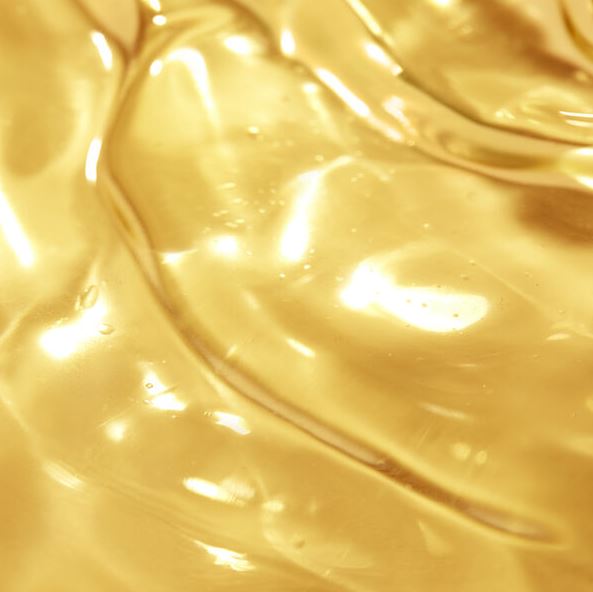 Close-up of smooth, golden liquid