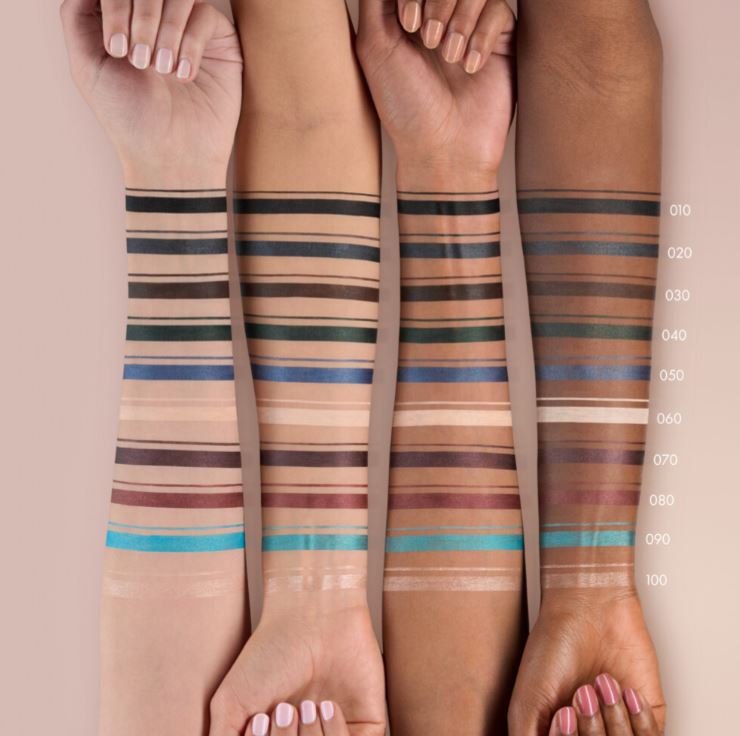 Three pairs of legs with striped tights on a beige background, showing a color swatch scale.