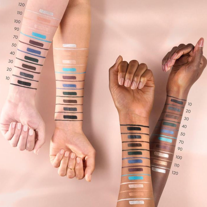 Color swatches on skin tones with a pink background