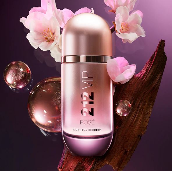 Perfume bottle with floral elements on a purple background