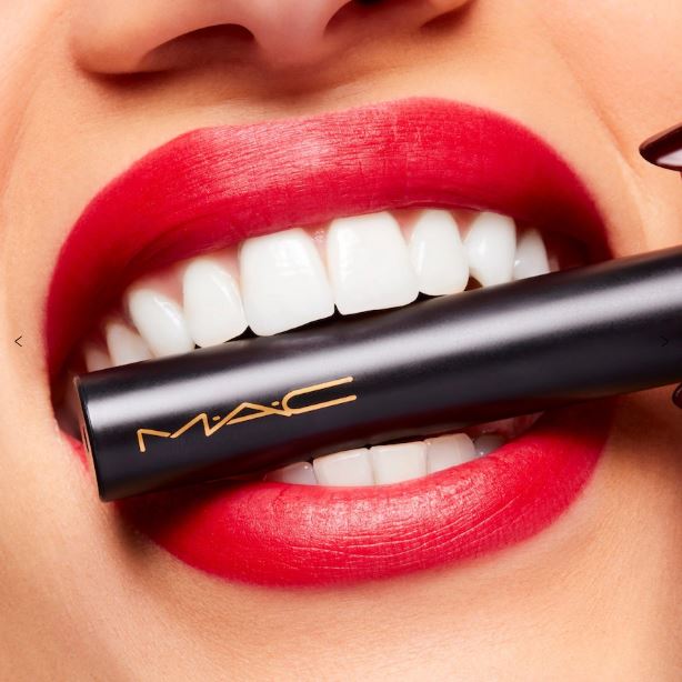 MAC lipstick being applied with a close-up of a mouth wearing red lipstick.
