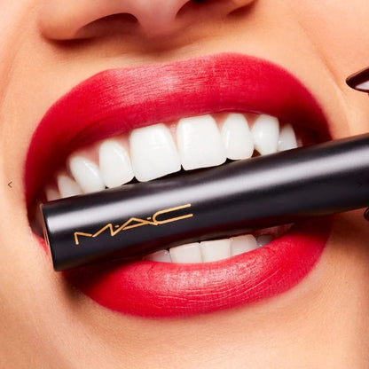 MAC lipstick being applied with a close-up of a mouth wearing red lipstick.