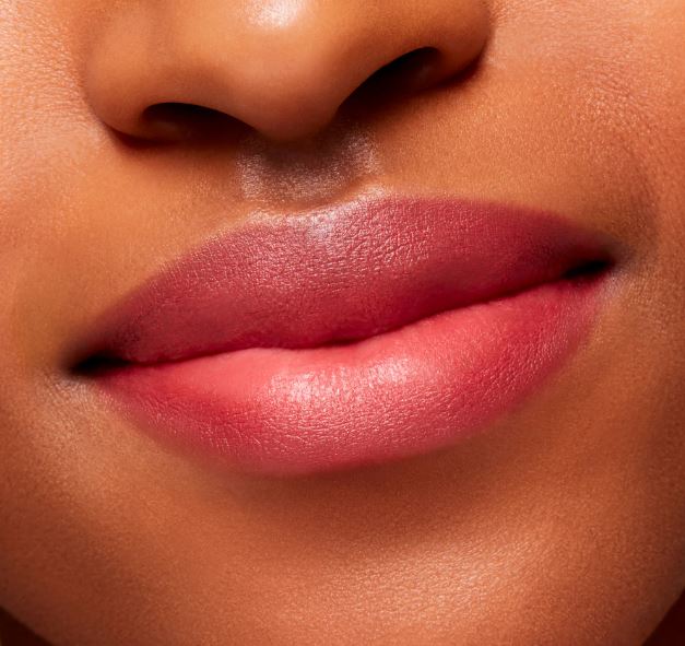 Close-up of a person's lips with a focus on the lipstick color.
