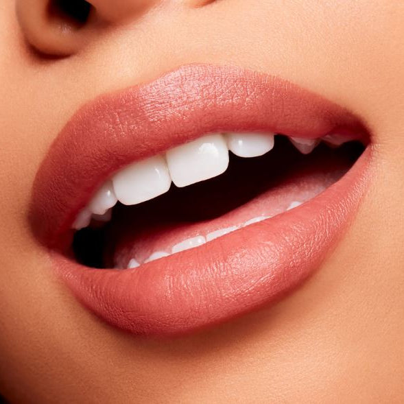 Close-up of a person's lips with a focus on the teeth.