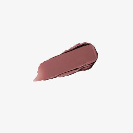 Nude-colored lipstick swatch on a light beige background