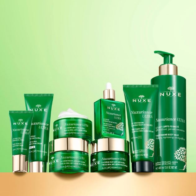 Nuxe skincare products on a green background