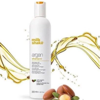 Milk Shake Argan Shampoo bottle with argan oil and nuts on a white background