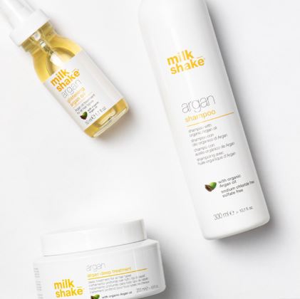 Milk Shake hair care products including shampoo, conditioner, and oil on a white background