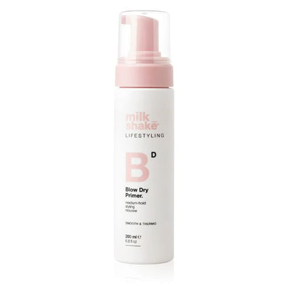 Milk Shake Blow Dry Primer bottle with pink pump on a white background