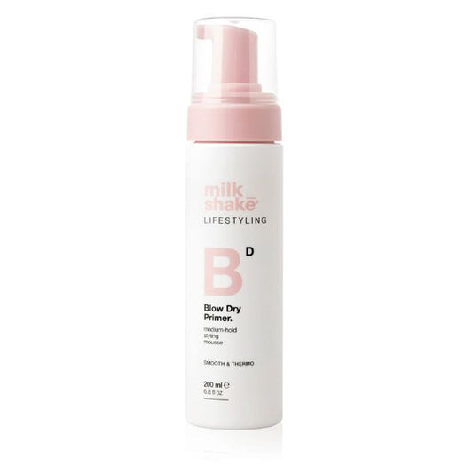 Milk Shake Blow Dry Primer bottle with pink pump on a white background