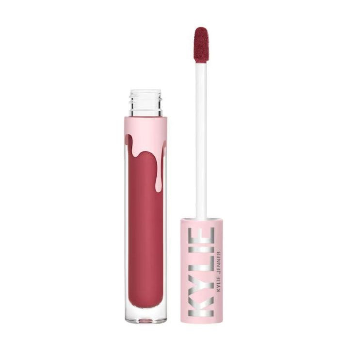 Lip gloss with applicator and pink container on a white background