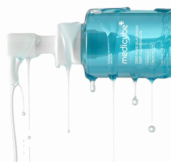 Medicube skincare product with blue liquid being dispensed onto a white surface