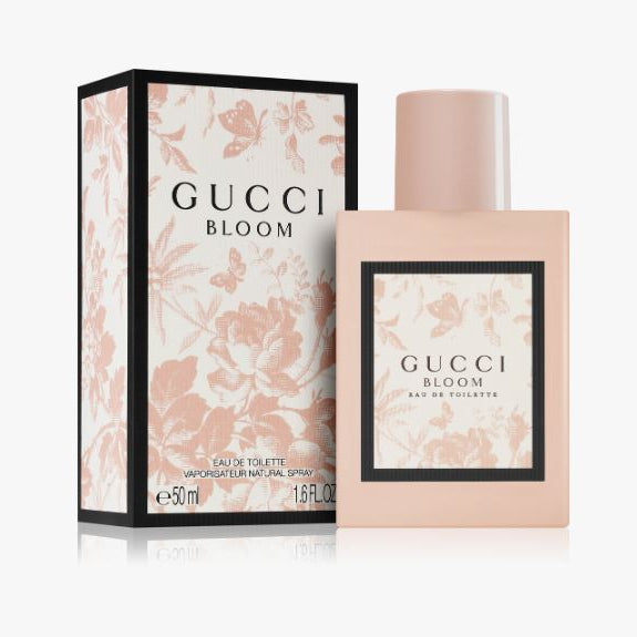 Gucci Bloom perfume bottle and packaging on a white background