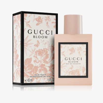 Gucci Bloom perfume bottle and packaging on a white background