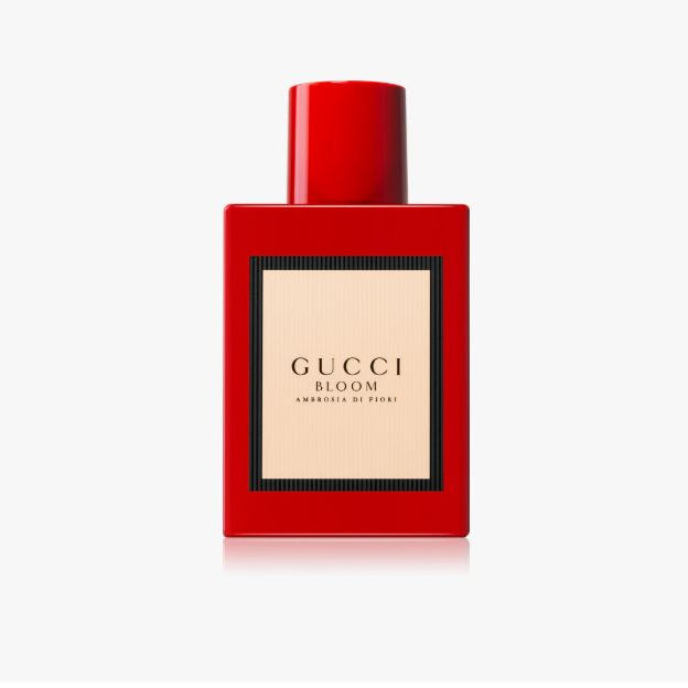 Red Gucci Bloom perfume bottle on a white background