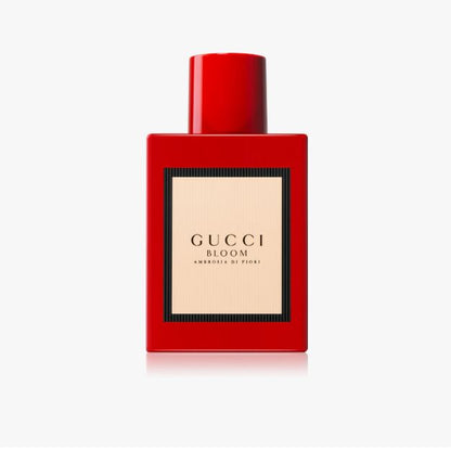 Red Gucci Bloom perfume bottle on a white background