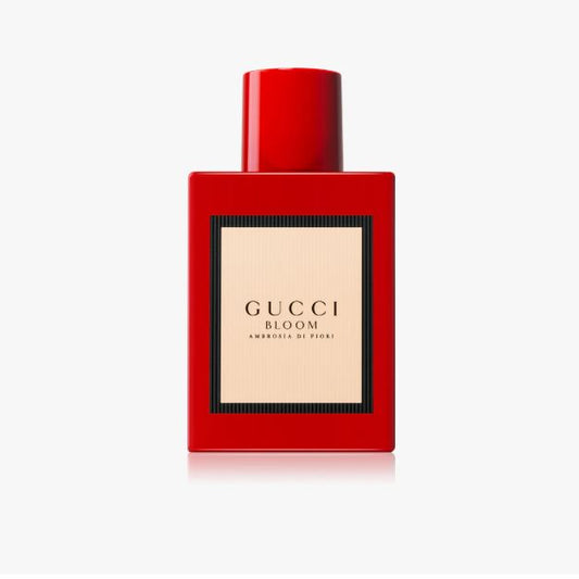 Red Gucci Bloom perfume bottle on a white background
