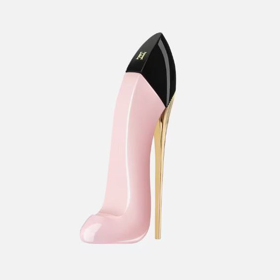 Pink high-heeled shoe with gold heel and black toe on a white background