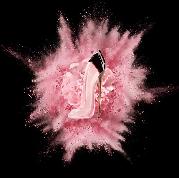 Pink feathered object with a logo on a black background