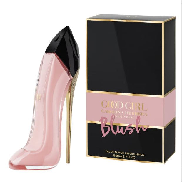 Pink high-heeled shoe-shaped perfume bottle with 'God Girl' packaging on a white background