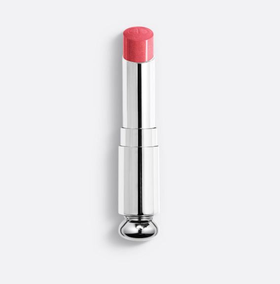 Lip balm with pink cap and silver body on a white background