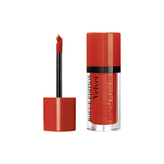 Red lipstick with applicator on a white background