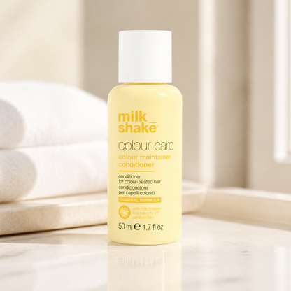 Milk Shake Colour Care conditioner bottle on a neutral background with towels.