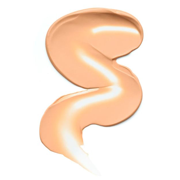 S-shaped swatch of beige cream on a white background