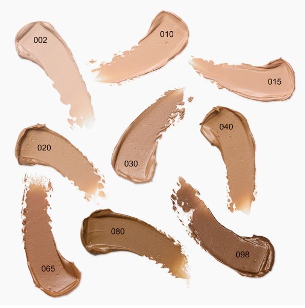Set of makeup swatches in various shades on a white background