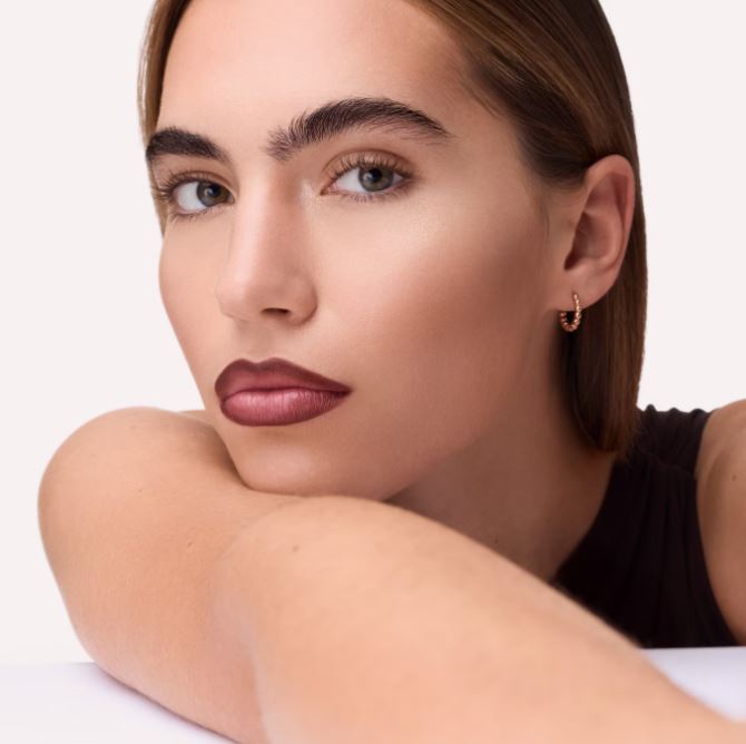 Close-up of a woman with a neutral background