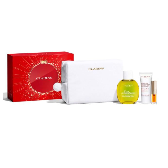Clarins skincare set with red box, white pouch, and skincare products on a white background