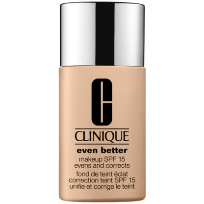 Clinique foundation bottle with beige body and silver cap on a white background
