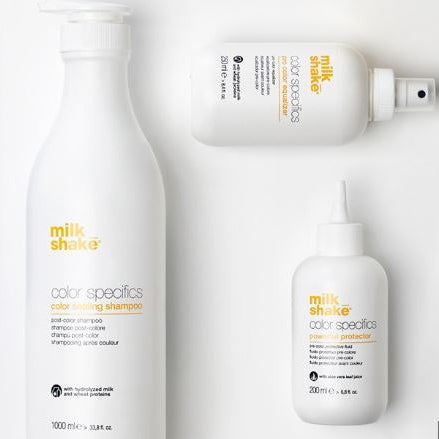 Collection of 'milk shake' hair care products on a white background