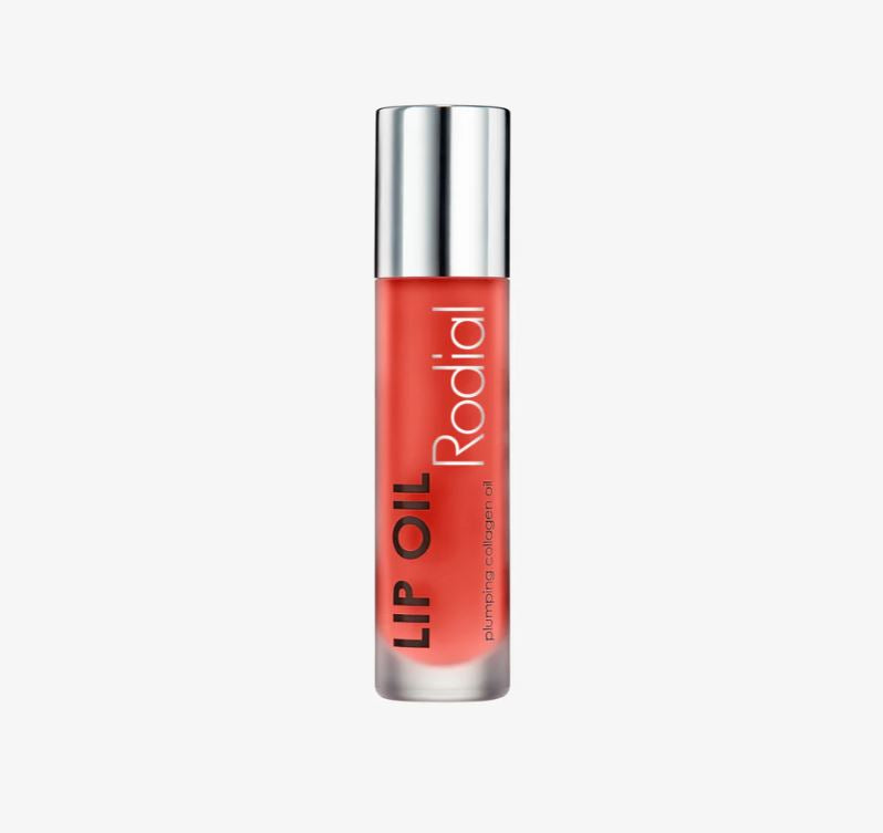 Rodial lip oil with silver cap on a white background