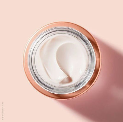 Jar of cream with a pink background