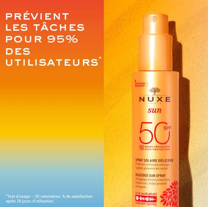 Nuxe sun spray bottle with SPF 50 on a gradient background