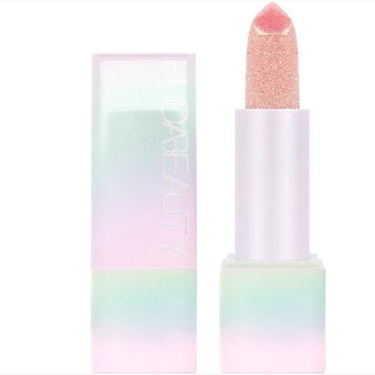 Pastel-colored lipstick with a matching case on a white background