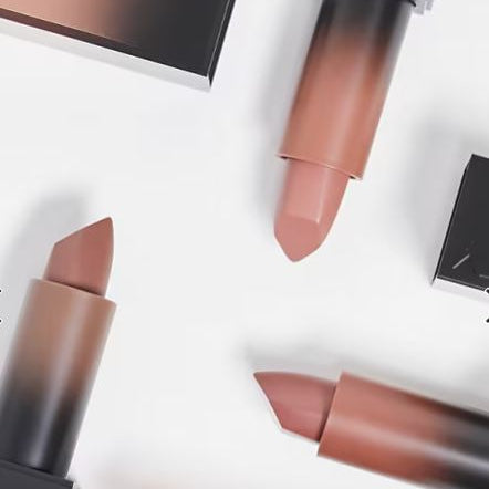 Three lipsticks with gradient shades on a white background