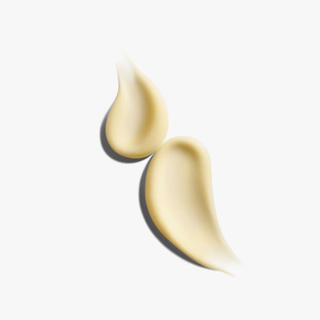 Two swatches of beige cream on a white background