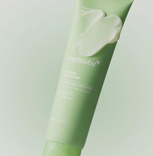 Green tube of Medicube cream with a light green background