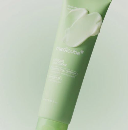 Green tube of Medicube cream with a light green background