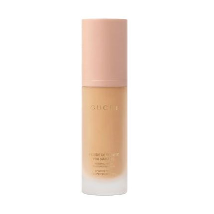 Gucci foundation bottle on a white background