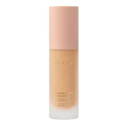 Gucci foundation bottle on a white background