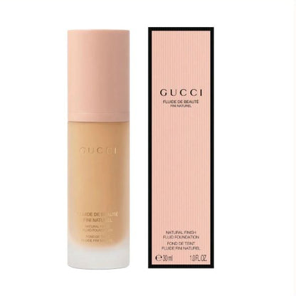 Gucci Fluide de Beaute foundation bottle and packaging on a white background