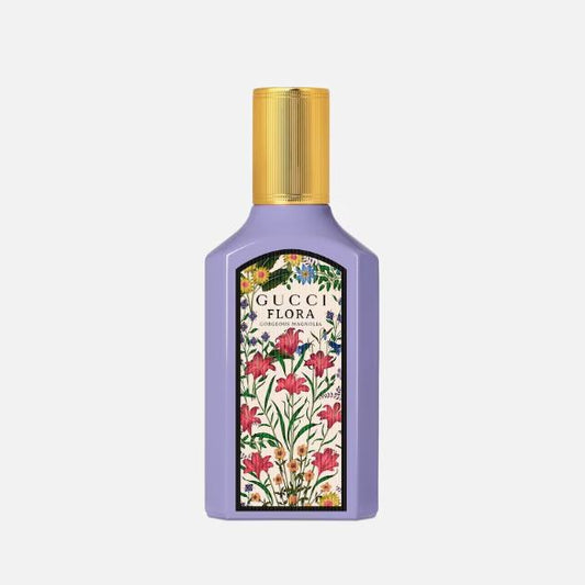 Gucci Flora perfume bottle with floral design on a white background