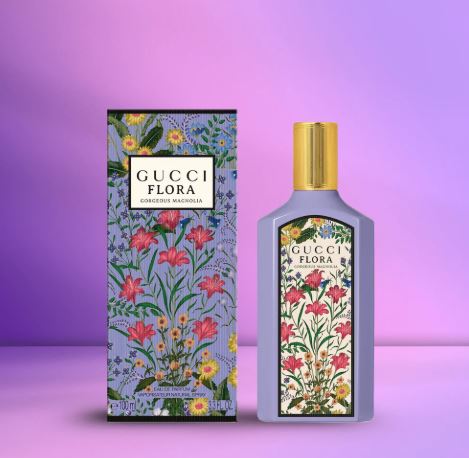 Gucci Flora perfume bottle and packaging on a purple background