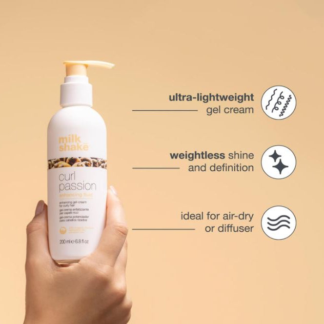 Hand holding a bottle of 'milk shake' curl cream against a beige background with product features listed.