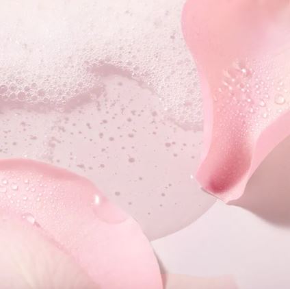 Close-up of pink bubbles on a light pink background